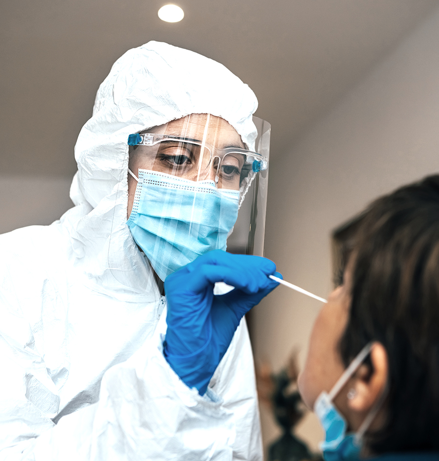 Close,Up,Of,Female,Health,Professional,In,Ppe,Introducing,A